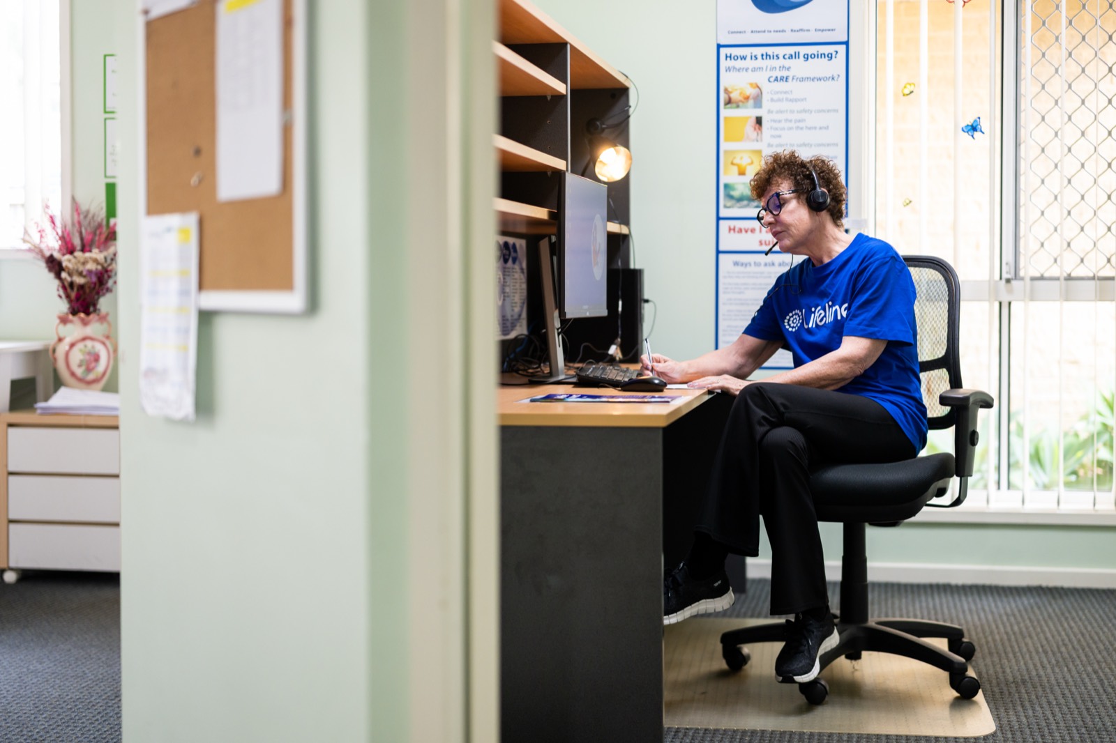 A Crisis Supporter taking a call on the 13 11 14 line