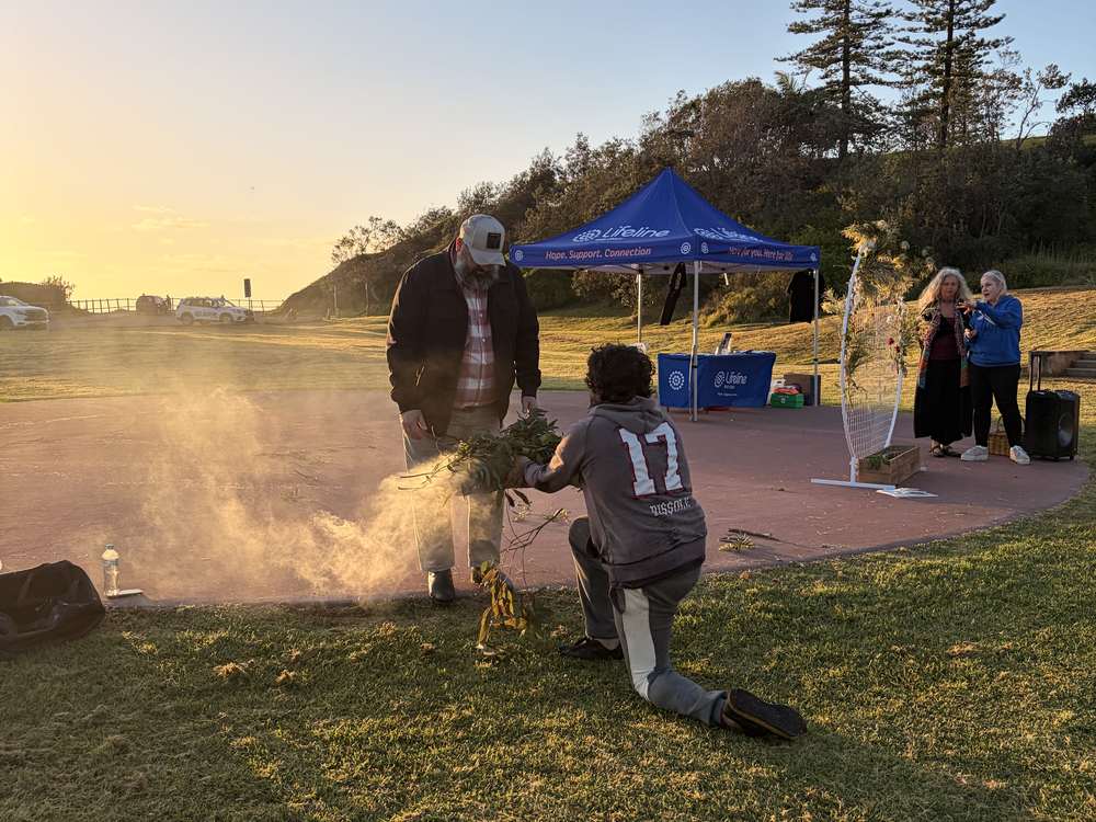 A smoking ceremony at the amphitheatre as the sun rises