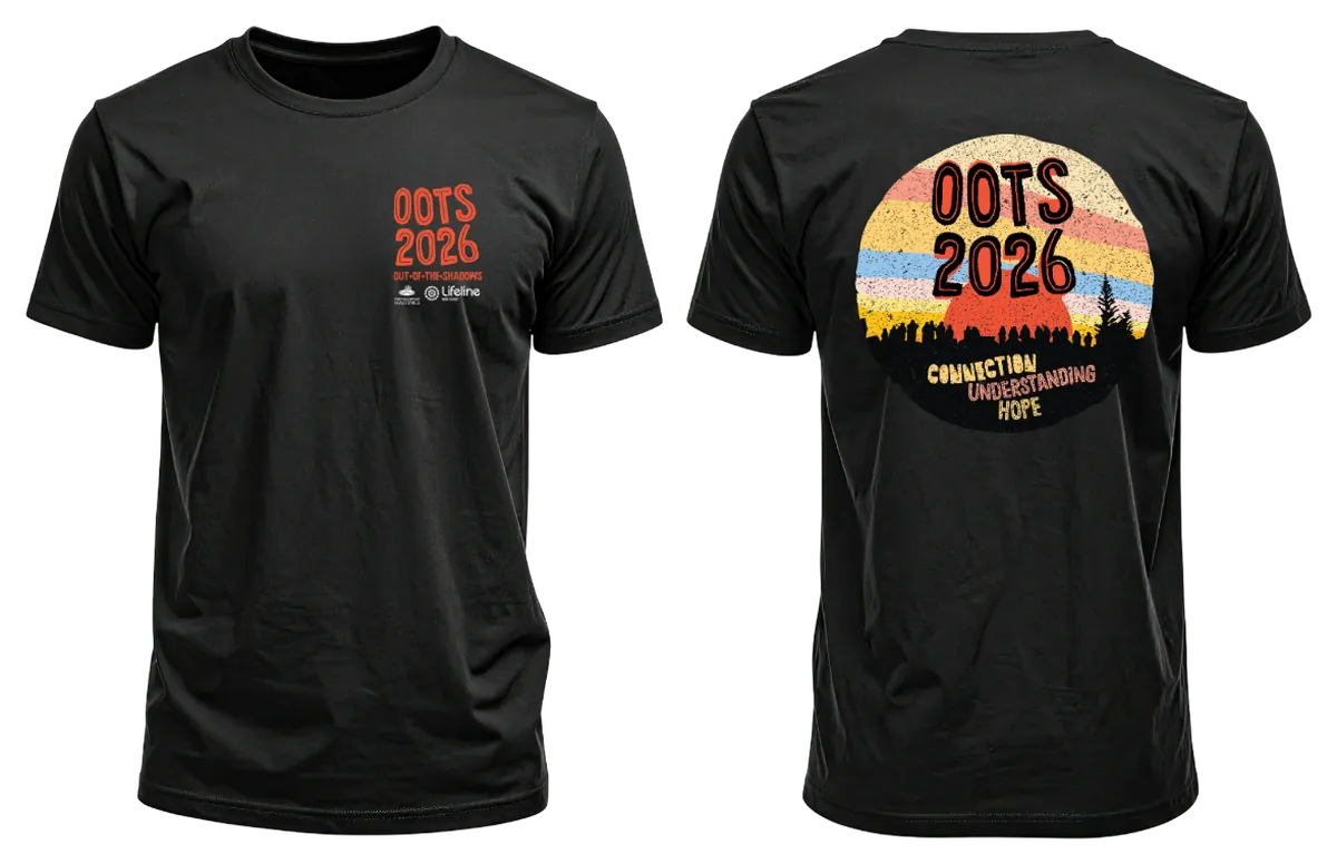 The OOTS 2026 t-shirt, front and back: black, with a small chest print, and on the back a retro sunrise rising behind a crowd of walkers above the words Connection, Understanding, Hope.